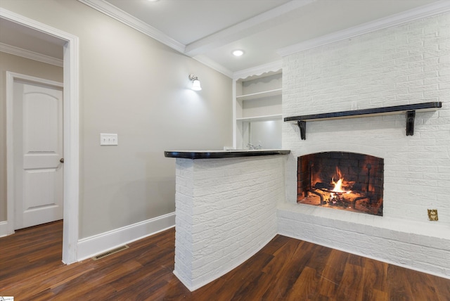 unfurnished living room with a brick fireplace, dark wood-type flooring, and crown molding