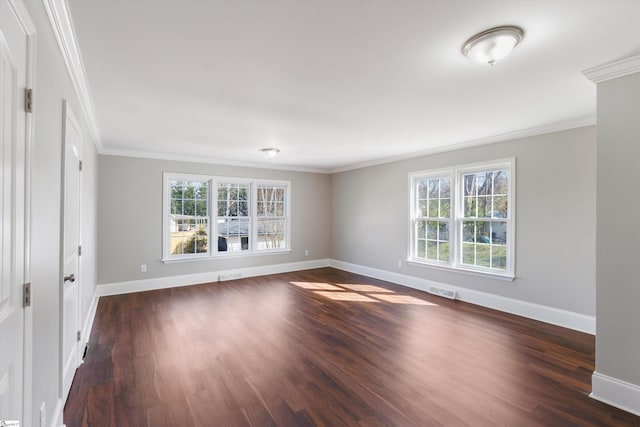 empty room with crown molding and dark hardwood / wood-style floors