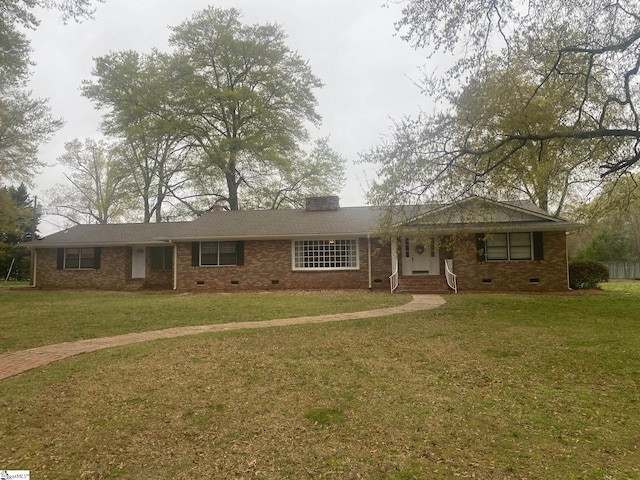 ranch-style house featuring a front lawn