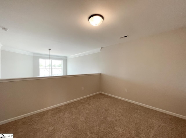 unfurnished room with carpet floors and ornamental molding