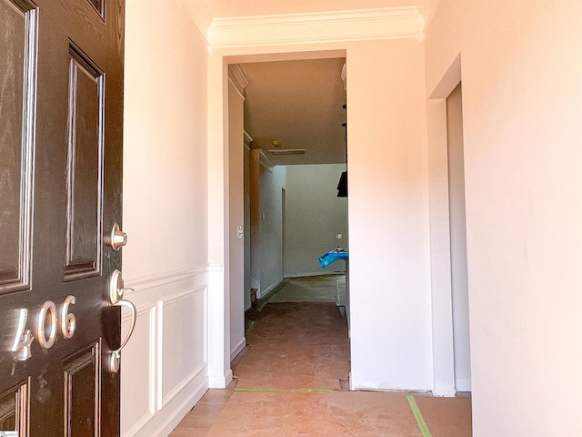 corridor featuring ornamental molding