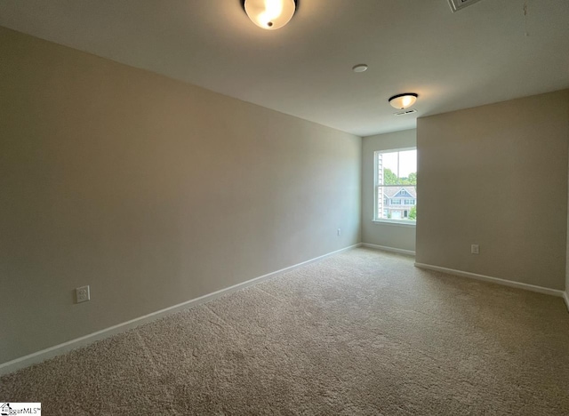 view of carpeted spare room