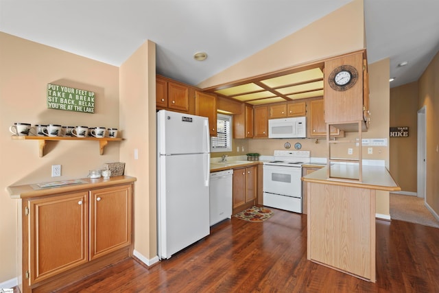 kitchen featuring white appliances, vaulted ceiling, dark hardwood / wood-style flooring, and sink