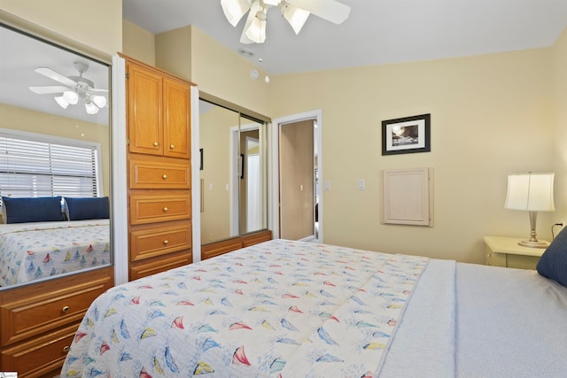 bedroom with ceiling fan, a closet, and vaulted ceiling