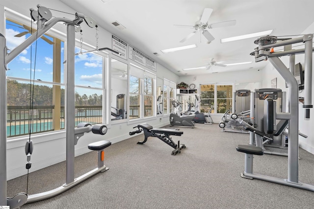 gym featuring ceiling fan and carpet