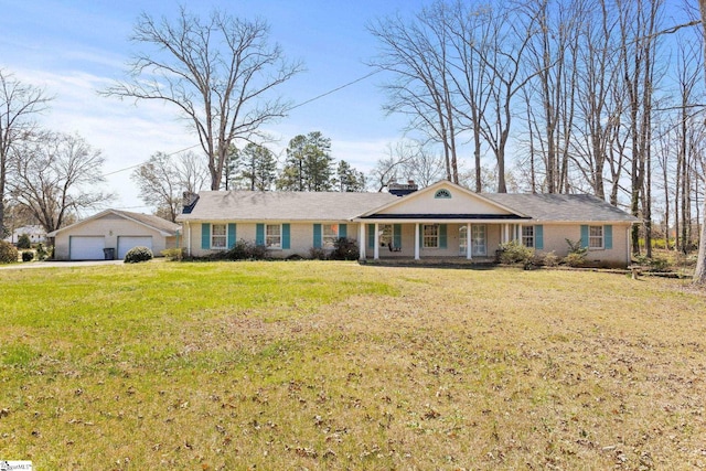 ranch-style home featuring a garage, a porch, and a front yard