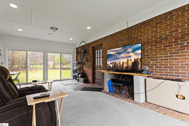 living room with brick wall