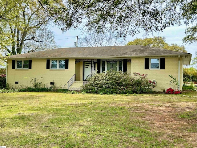 single story home featuring a front yard