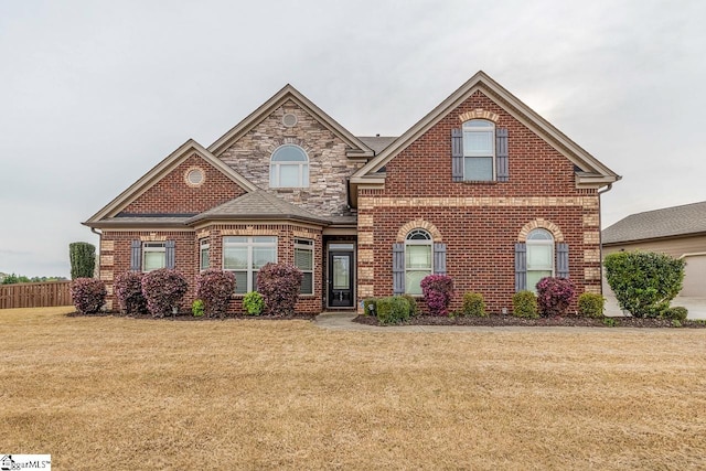 front of property with a front lawn and a garage