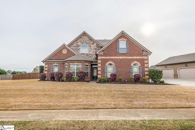 view of front of property with a front yard and a garage