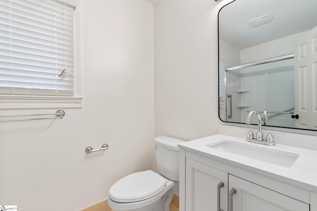 bathroom with toilet and oversized vanity