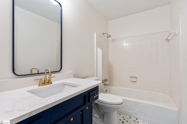 full bathroom with tile flooring, toilet, tiled shower / bath combo, and vanity