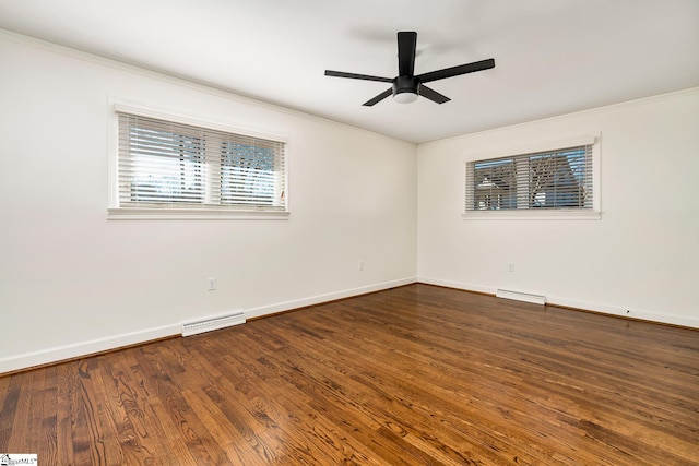 empty room with ceiling fan, crown molding, and dark hardwood / wood-style floors