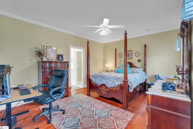 bedroom featuring ceiling fan, ornamental molding, and hardwood / wood-style flooring