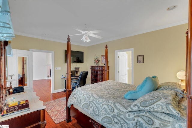 bedroom featuring ceiling fan, hardwood / wood-style flooring, and ornamental molding