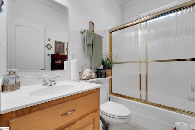 full bathroom with tile flooring, vanity with extensive cabinet space, toilet, shower / bath combination with glass door, and ornamental molding