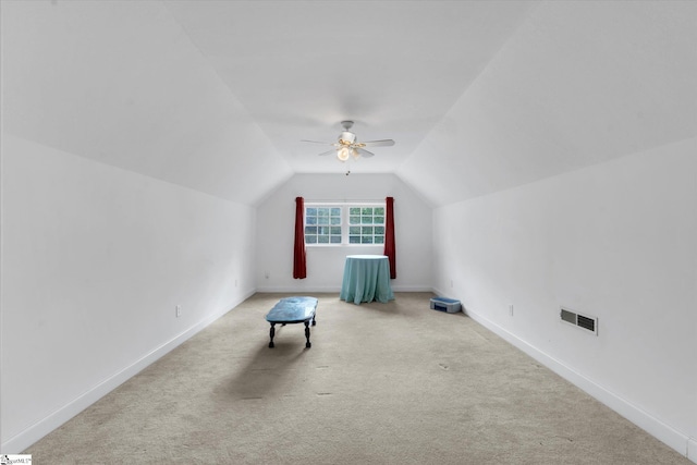 bonus room featuring lofted ceiling, ceiling fan, and light carpet