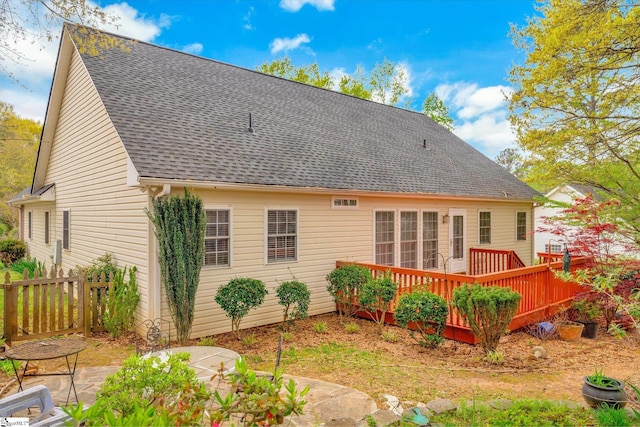 back of property featuring a deck