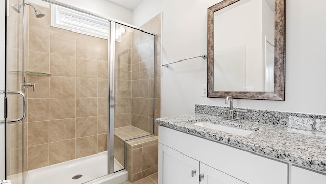 bathroom featuring vanity and walk in shower