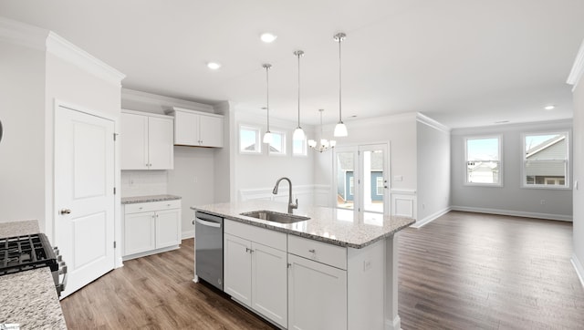 kitchen featuring sink, white cabinetry, a kitchen island with sink, stainless steel appliances, and light stone countertops