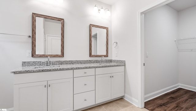 bathroom featuring vanity and wood-type flooring