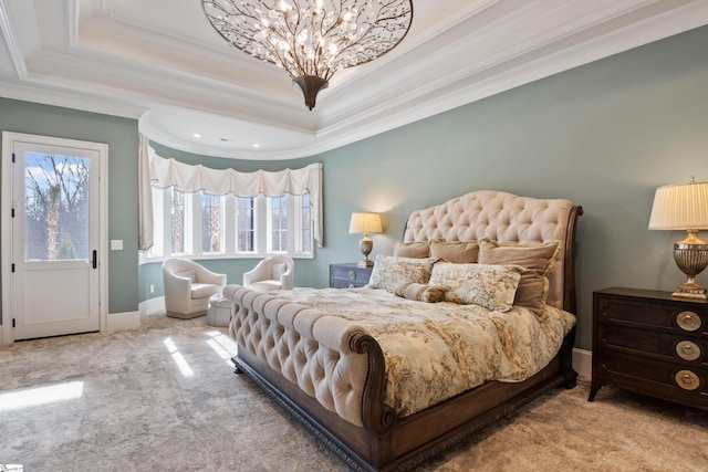 bedroom with crown molding, a raised ceiling, and light carpet