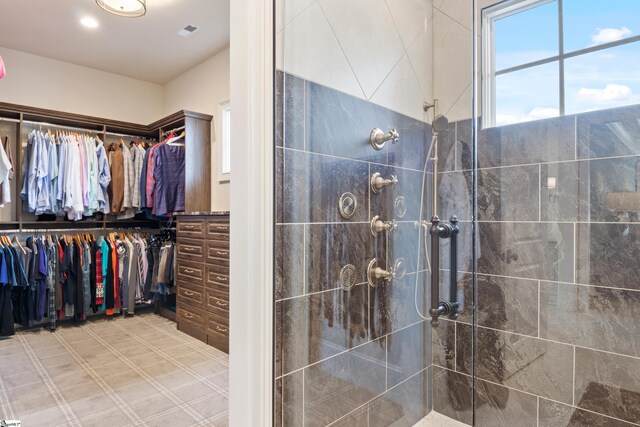 bathroom with a tile shower