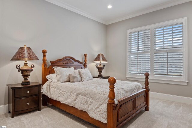 carpeted bedroom with ornamental molding