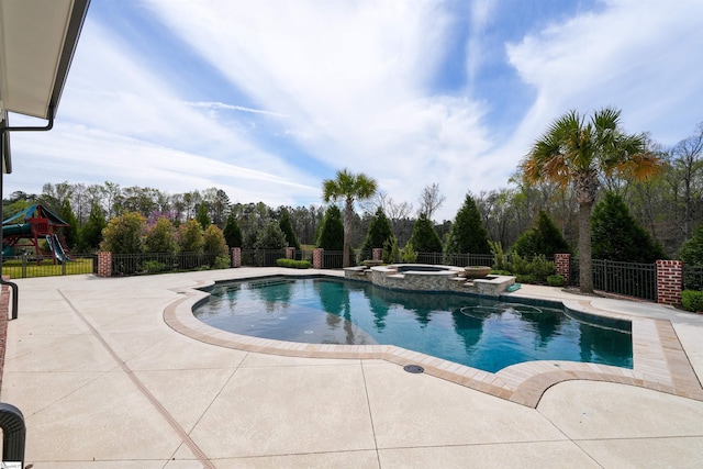 view of swimming pool featuring an in ground hot tub and a patio