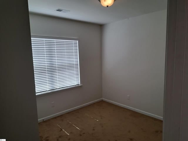 view of carpeted spare room