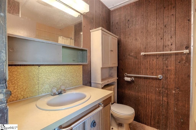 bathroom featuring toilet and large vanity