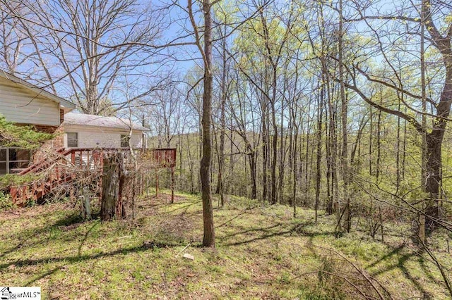 view of yard with a wooden deck