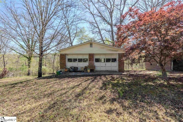 garage featuring a yard