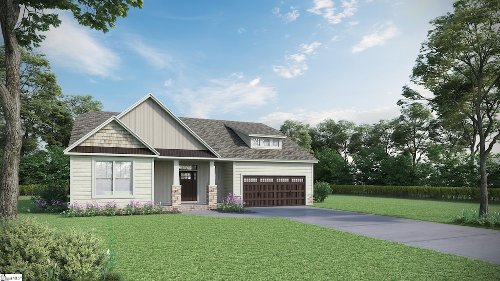 craftsman house featuring a front yard and a garage