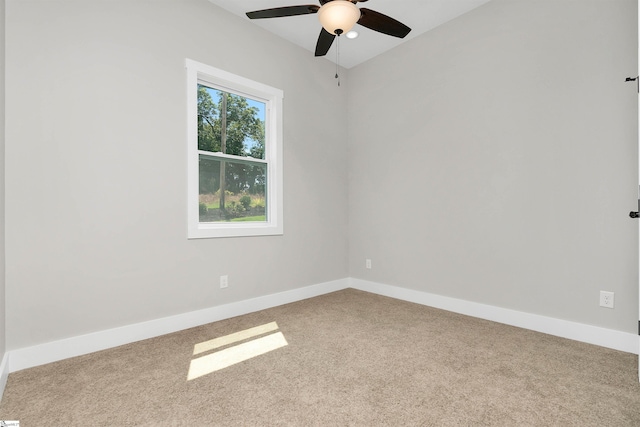 unfurnished room featuring light carpet and ceiling fan