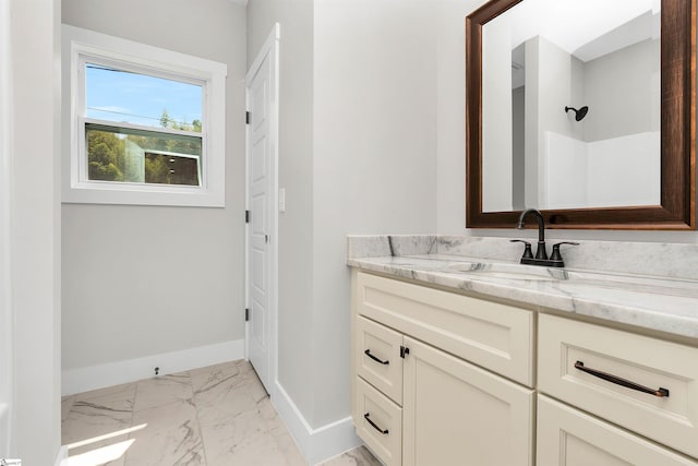 bathroom featuring vanity and tile flooring