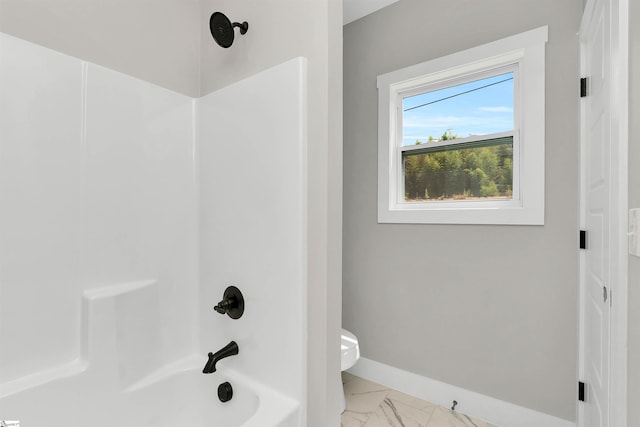 bathroom with tile flooring,  shower combination, and toilet