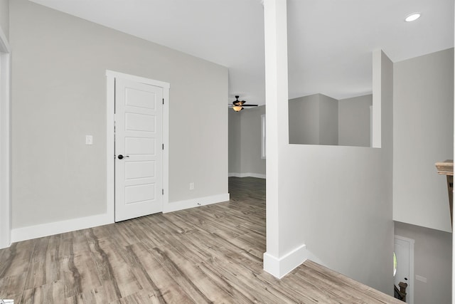 spare room featuring ceiling fan and light hardwood / wood-style floors