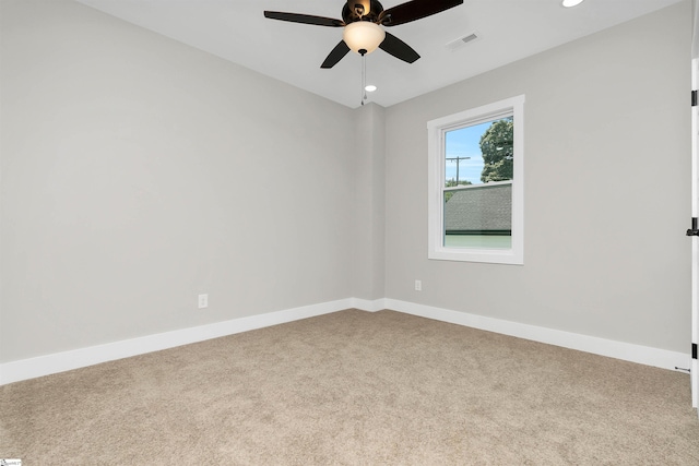 unfurnished room with light carpet and ceiling fan