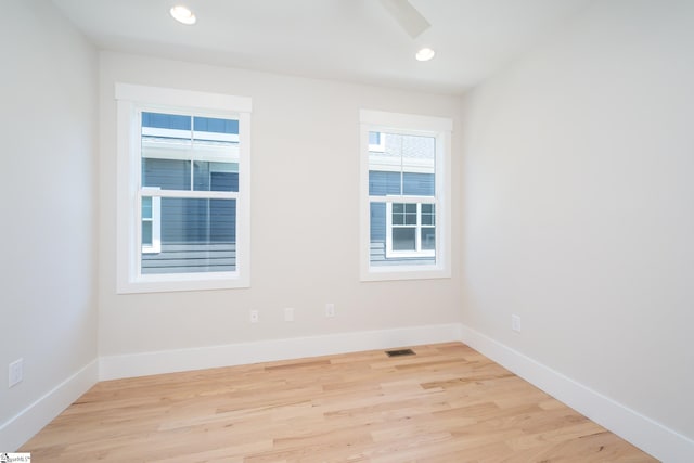 spare room with light wood-type flooring