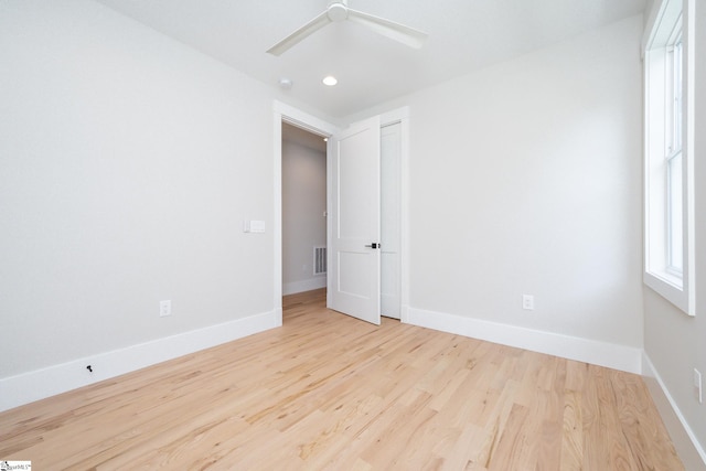 empty room featuring light hardwood / wood-style flooring and ceiling fan