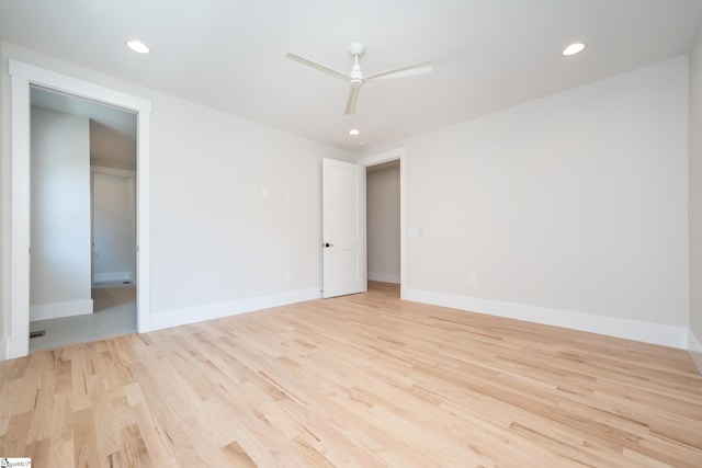 spare room featuring ceiling fan and light hardwood / wood-style floors