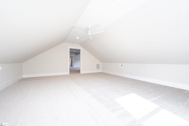 bonus room featuring light colored carpet, vaulted ceiling, and ceiling fan