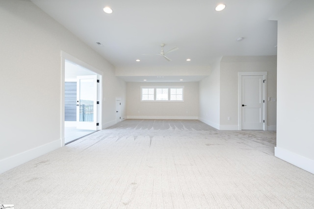 unfurnished room with light carpet and ceiling fan