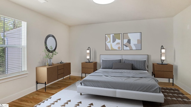 bedroom with wood-type flooring