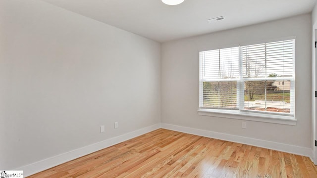 empty room with light hardwood / wood-style floors