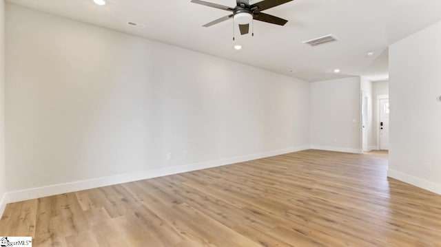 empty room with light hardwood / wood-style floors and ceiling fan