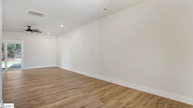 empty room featuring ceiling fan and light wood-type flooring