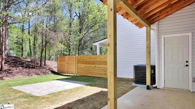 view of yard featuring central AC unit and a patio area