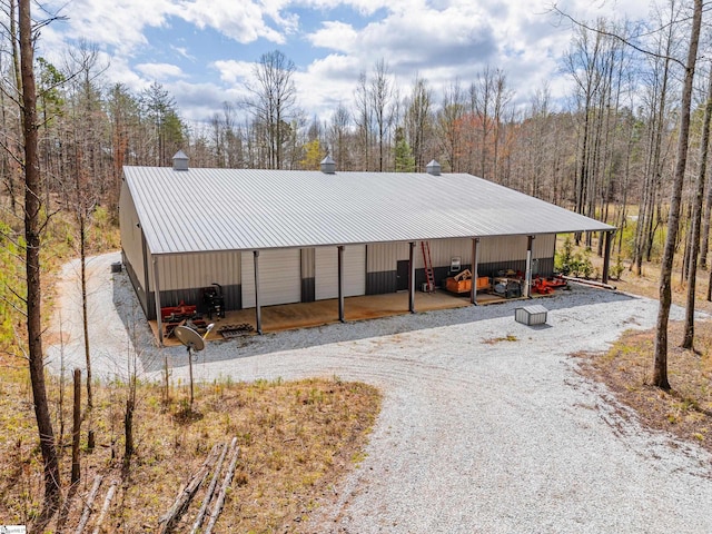 view of front of home featuring a carport